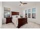 Bright bedroom with wood bed frame and large windows at 2706 E Lovebird Ln, Gilbert, AZ 85297