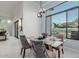 Elegant dining area with a glass table and stylish chairs at 2706 E Lovebird Ln, Gilbert, AZ 85297