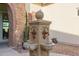 Ornate fountain with four spouts in a courtyard setting at 2706 E Lovebird Ln, Gilbert, AZ 85297