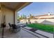 Covered patio with seating and pool view at 2706 E Lovebird Ln, Gilbert, AZ 85297