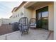 Relaxing patio with wicker chairs and access to the interior at 2706 E Lovebird Ln, Gilbert, AZ 85297