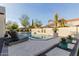 Inviting pool area with lounge chairs and lush landscaping at 2706 E Lovebird Ln, Gilbert, AZ 85297