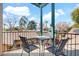 Balcony features seating area with views of lush greenery and blue skies at 311 W Georgia Ave, Phoenix, AZ 85013