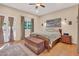 Relaxing bedroom featuring hardwood floors, neutral tones, and French doors leading to a tranquil outdoor space at 311 W Georgia Ave, Phoenix, AZ 85013