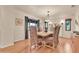 Dining room features hardwood floors, large windows, and an elegant chandelier at 311 W Georgia Ave, Phoenix, AZ 85013