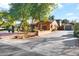 Exterior view of the home showing the driveway and a detached garage at 311 W Georgia Ave, Phoenix, AZ 85013