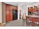 Kitchen featuring dark cabinetry, stainless steel appliances, and a center island with bar seating at 311 W Georgia Ave, Phoenix, AZ 85013