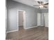 Generous primary bedroom with a ceiling fan and multiple doorways and windows at 320 E Mckellips Rd # 50, Mesa, AZ 85201