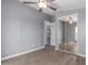 Bedroom featuring ceiling fan and mirrored closet doors at 320 E Mckellips Rd # 50, Mesa, AZ 85201