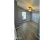 Well-lit bedroom with wood-look floors and ceiling fan at 320 E Mckellips Rd # 50, Mesa, AZ 85201