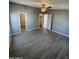 Spacious bedroom with gray walls, ceiling fan, and wood-look flooring at 320 E Mckellips Rd # 50, Mesa, AZ 85201