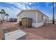 Inviting exterior view showcases the home's well-kept landscaping and a convenient storage shed at 320 E Mckellips Rd # 50, Mesa, AZ 85201