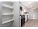 Kitchen featuring white cabinets, solid countertops, and stainless steel appliances at 320 E Mckellips Rd # 50, Mesa, AZ 85201