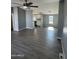 Open living room and kitchen with gray walls and wood-look floors at 320 E Mckellips Rd # 50, Mesa, AZ 85201