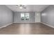 Living room features a neutral color palette, ceiling fan, and lots of natural light at 320 E Mckellips Rd # 50, Mesa, AZ 85201