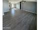 Spacious living area features gray walls and wood-look flooring at 320 E Mckellips Rd # 50, Mesa, AZ 85201