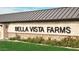 Bella Vista Farms community entrance sign with stone facade at 32693 N Newby Dr, San Tan Valley, AZ 85143