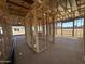 Interior view of a home under construction, showing the wall and ceiling framing, and a view to the outside at 32693 N Newby Dr, San Tan Valley, AZ 85143