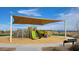 Community playground with shade structure and play equipment at 32693 N Newby Dr, San Tan Valley, AZ 85143