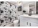 Well-lit bathroom featuring a shower with a decorative shower curtain, and ample counter space at 3320 E Tina Dr, Phoenix, AZ 85050