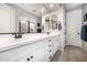 Bathroom featuring a double sink vanity, framed mirrors, and tile flooring, offering a modern look at 3320 E Tina Dr, Phoenix, AZ 85050