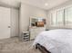 Cozy bedroom featuring neutral walls, plantation shutters, and plenty of natural light at 3320 E Tina Dr, Phoenix, AZ 85050