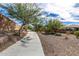 Tranquil community walkway featuring mature trees and desert landscaping providing a serene environment at 3320 E Tina Dr, Phoenix, AZ 85050