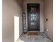 Stylish front door with decorative glass, a 'Welcome' sign, and a 'Sweet Home' doormat creates an inviting entry at 3320 E Tina Dr, Phoenix, AZ 85050