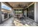 Outdoor covered patio featuring a built-in grill, outdoor dining area, and ceiling fan at 3320 E Tina Dr, Phoenix, AZ 85050