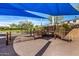 Playground with ramps, stairs, and slides under a blue shade covering at 3320 E Tina Dr, Phoenix, AZ 85050