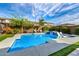 Gorgeous backyard pool with a water feature, tanning deck, and lush landscaping at 3320 E Tina Dr, Phoenix, AZ 85050