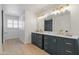 Stylish bathroom with dark vanity and gold fixtures at 37020 N 31St Ave, Phoenix, AZ 85086