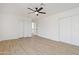 Bright bedroom featuring wood flooring and double closets at 37020 N 31St Ave, Phoenix, AZ 85086