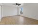 Spacious bedroom with light wood floors and ceiling fan at 37020 N 31St Ave, Phoenix, AZ 85086