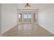 Bright dining area with bay windows, hardwood floors, and a chandelier at 37020 N 31St Ave, Phoenix, AZ 85086