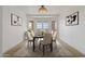 Elegant dining room with bay windows offering stunning views and a chandelier at 37020 N 31St Ave, Phoenix, AZ 85086