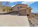 House exterior with three-car garage and mountain views at 37020 N 31St Ave, Phoenix, AZ 85086