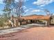 House with porte-cochère and desert landscape at 37020 N 31St Ave, Phoenix, AZ 85086