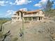 Two-story home with balconies, columns and desert landscape at 37020 N 31St Ave, Phoenix, AZ 85086