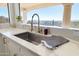 Kitchen sink with marble countertop and a stunning mountain view at 37020 N 31St Ave, Phoenix, AZ 85086