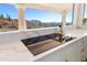 Kitchen with cooktop and expansive windows showcasing scenic views at 37020 N 31St Ave, Phoenix, AZ 85086