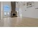 Living room with stone fireplace and large windows at 37020 N 31St Ave, Phoenix, AZ 85086