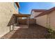 Backyard featuring gravel and a covered patio, perfect for outdoor relaxation and entertainment at 3801 E Kent Dr, Phoenix, AZ 85044