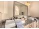 Bathroom featuring double sink with granite counters, modern fixtures, and neutral color palette at 3801 E Kent Dr, Phoenix, AZ 85044