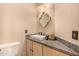 Elegant bathroom with granite vanity, stylish mirror, and modern fixtures adds a touch of luxury at 3801 E Kent Dr, Phoenix, AZ 85044