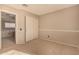 Bedroom with neutral carpet, bright natural light, and a large closet for storage at 3801 E Kent Dr, Phoenix, AZ 85044