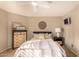 Cozy bedroom with a ceiling fan, neutral decor, a comfortable bed, and two matching nightstands at 3801 E Kent Dr, Phoenix, AZ 85044