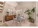 Bright dining area with vaulted ceiling, stylish furnishings, and elegant accent mirror creates a cozy atmosphere at 3801 E Kent Dr, Phoenix, AZ 85044