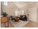 Bright living room with modern decor, neutral walls, vaulted ceilings, and wood-look flooring at 3801 E Kent Dr, Phoenix, AZ 85044