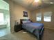 Spacious bedroom with a large bed and ensuite bathroom at 41262 W Almira Dr, Maricopa, AZ 85138